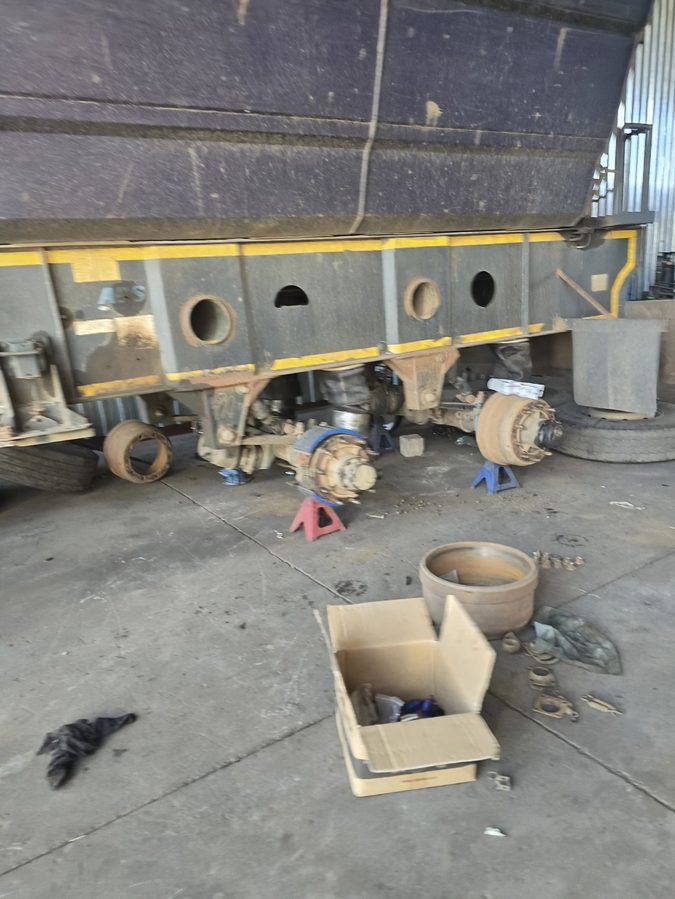 Trailer axle stripped down on stands during an HGV mechanic trade test