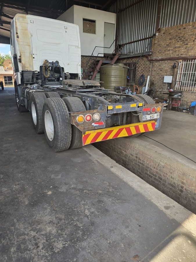Tractor unit positioned over the inspection pit